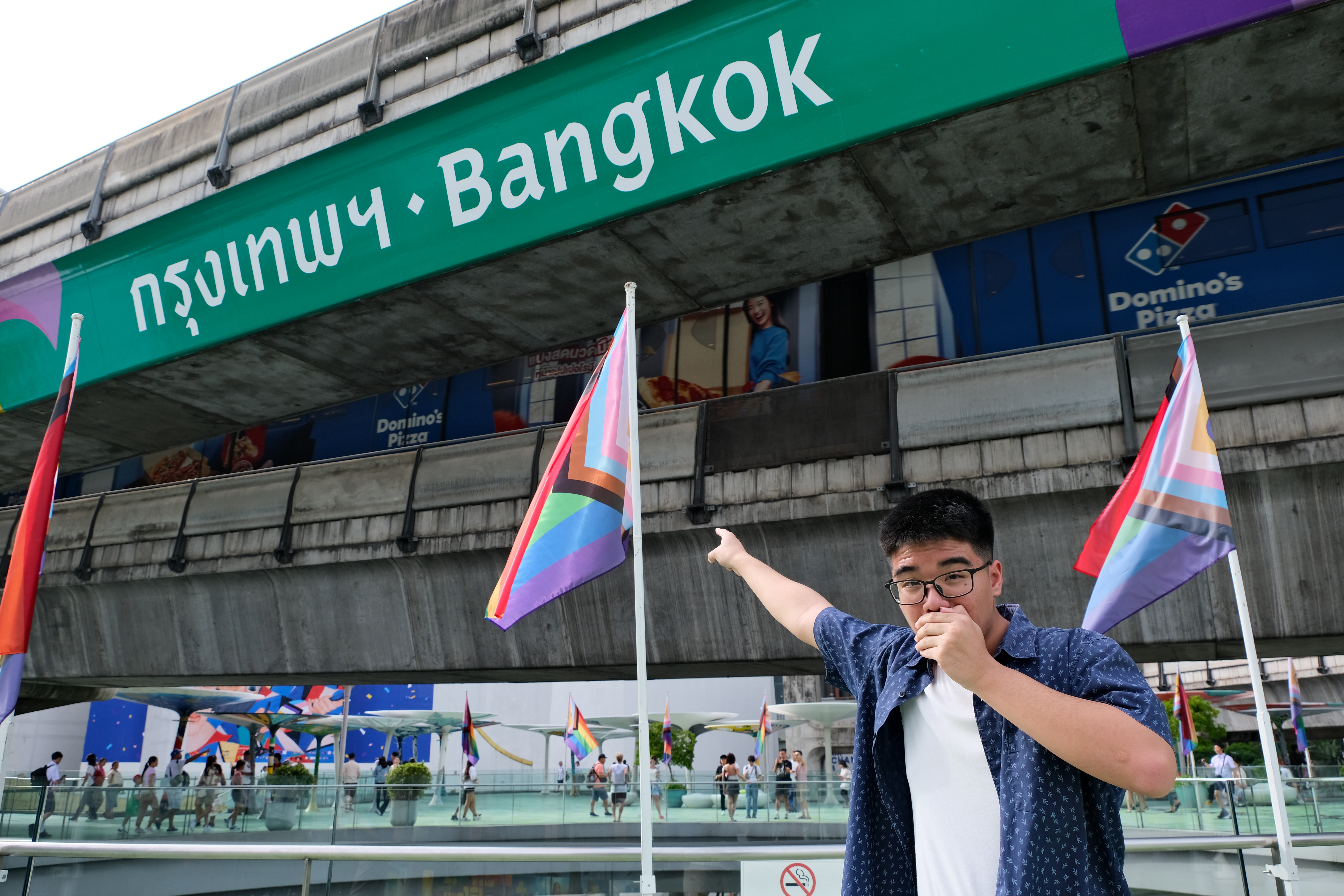 Me pointing to the green Bangkok sign